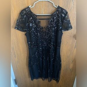 Black very sparkly flapper dress.